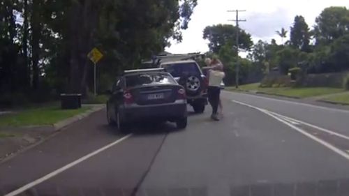 The man in the yellow shirt was the first to strike. (Dash Cam Owners Australia)