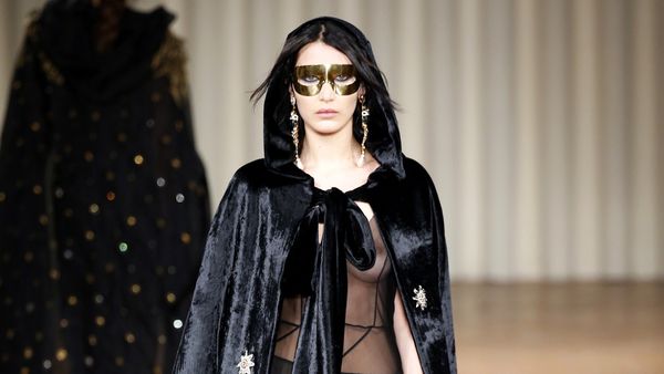 Bella Hadid's boob pops completely out as she leaves London Fashion week