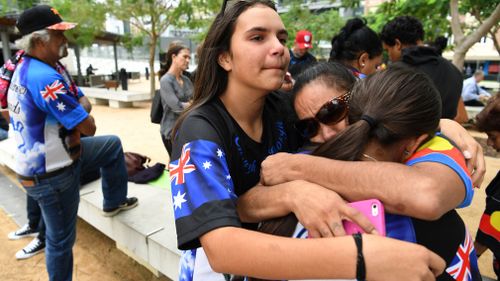 Family of one-punch victim Trevor Duroux embrace outside the Supreme Court. (AAP)