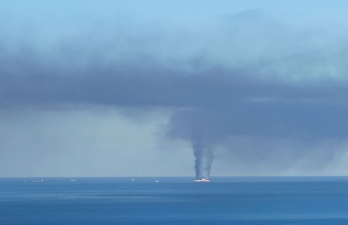 19 February 2022, Albania, Lukova: Smoke rises from a ship off the Greek island of Corfu. A fire broke out on a car ferry near the island on Friday morning. According to Greek media reports, there were around 240 passengers and 50 crew members on the ship. 
