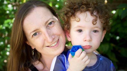 Volunteer Meredith Bale with son. (Ehsan Knopf/9NEWS)