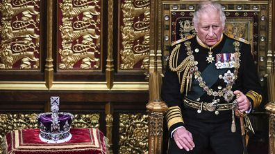 Prince Charles, Prince of Wales (R) sits next to the Imperial State Crown (L) in the House of Lords, during the official opening of Parliament, at the Houses of Parliament, London, 10 May 2022