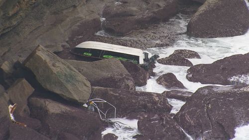 A man has been winched to safety after his boat capsized in rough sea in Sydney's south.