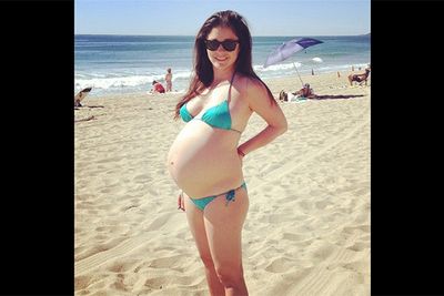 <i>Girls</i> star, Shiri Appleby, was more than happy to show off her bulging belly when she took to the beach in this itty-bitty, green bikini. <br/><br/>Image: Instagram @shiriappleby
