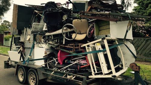 Melbourne man fined for towing trailer carrying a tower of junk