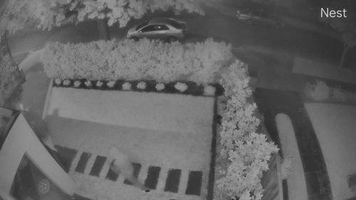 Three men were caught on security cameras as they cased out half a dozen homes along the quiet street this morning.