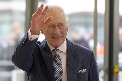 Britain's King Charles III waves as he arrives for a visit to the new European Bank for Reconstruction and Development (EBRD) in London, Thursday, March 23, 2023.