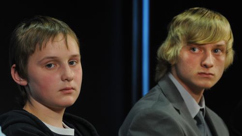 Sons of missing woman Belinda Peisley Billy Moffett (left), 14, and Cody Peisley, 16, and Belinda's father Mark Wearne attend a police press conference in Sydney in 2011.