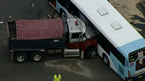 Infant and toddler in serious condition after truck, bus and car collide in Sydney's west