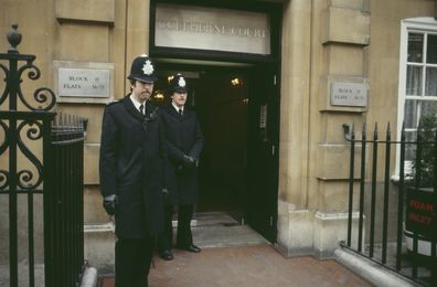 Two policemen outside Lady Diana Spencer's London flat on Coleherne Court, UK, November 1980. 