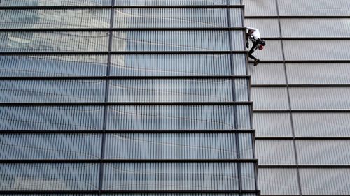 Alain Robert, dubbed the 'French Spiderman', climbed London's 230m-tall Heron Tower on Thursday local time.