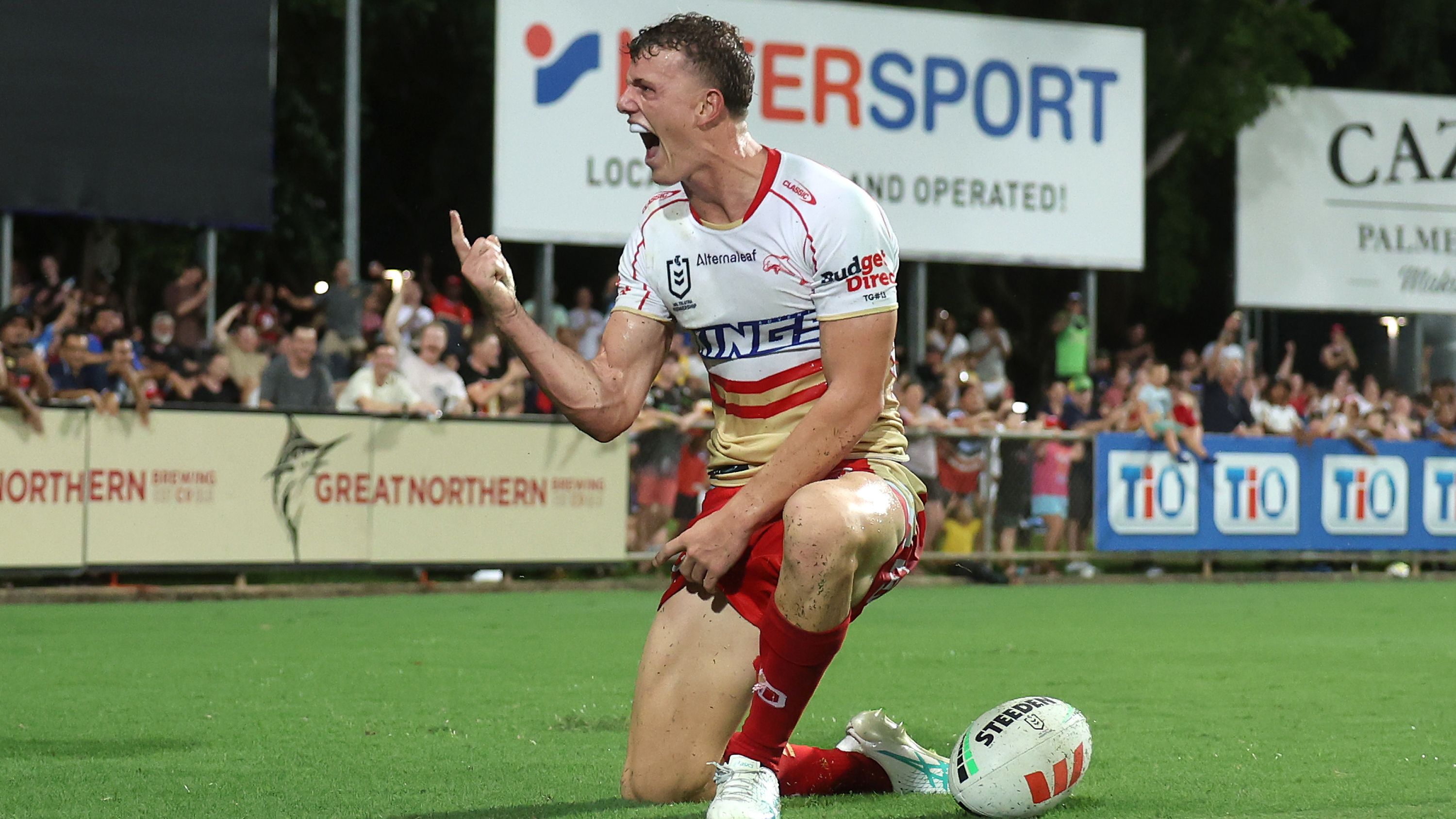 Jack Bostock of the Dolphins celebrates after scoring a try against the Eels.