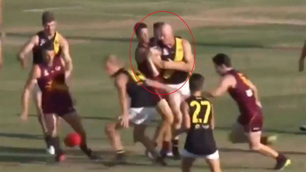 Former AFL star Barry Hall punches opposition players in QAFL grand final