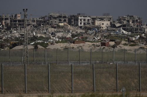 Destroyed buildings stand in the Gaza Strip as seen from southern Israel, Thursday, March 28, 2024. 