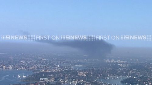 Smoke shrouds Sydney near Gladesville. (9NEWS)