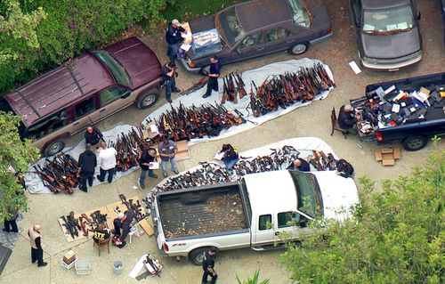 Authorities seized more than a thousand guns from an LA home after getting an anonymous tip regarding illegal firearms sales in a posh area near the Playboy Mansion.