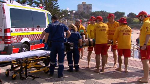 A man, aged in his 30s, was dragged from the surf today. (9NEWS)