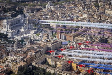 Jets from the United Kingdom's Royal Air Force Aerobatic Team, the Red Arrows, bottom, and the Italian Frecce Tricolori acrobatic squad
