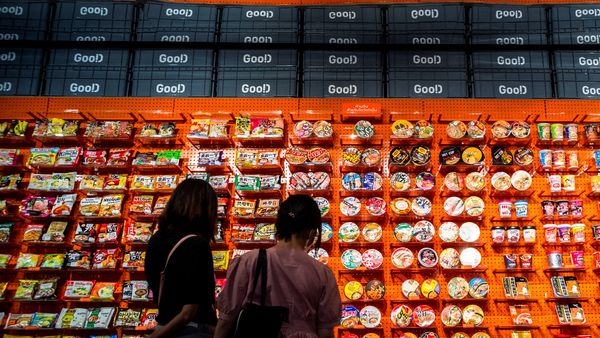 People browse instant noodles at the Good Noodle store in Bangkok, Thailand, March 21, 2022.  