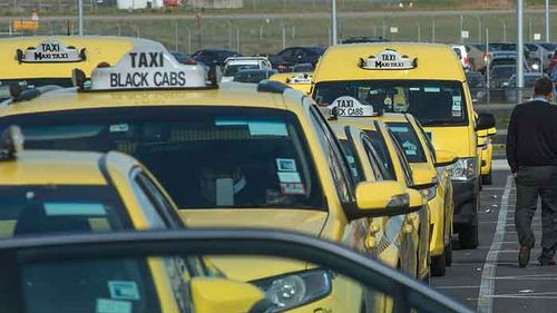 Taxis line up outside Melbourne Airport.
