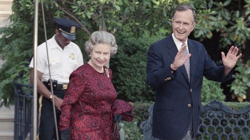 George H.W. Bush with The Queen.