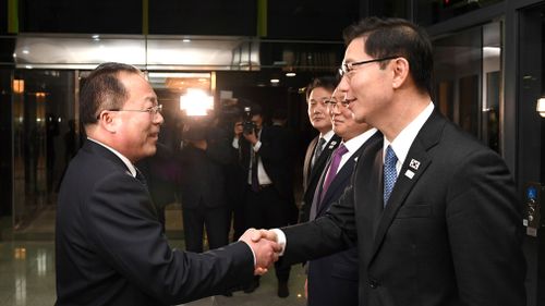 South Korean Vice Unification Minister Chun Hae-sung, right, shakes hands with the head of North Korean delegation Jon Jong Su after a meeting at Panmunjom. (AAP)