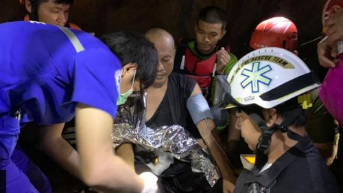 Medics provide treatment to the monk after Phra Ajarn Manas' rescue.