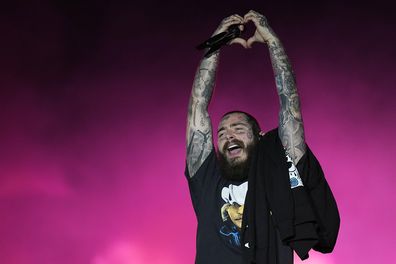 American rapper Post Malone performs during the Qatar Fashion United event at the Stadium 974 in Doha, Qatar, Friday, Dec. 16, 2022. (AP Photo/Pavel Golovkin)