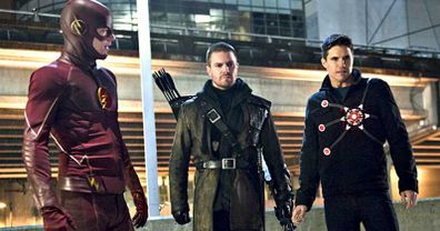 Grant Gustin as The Flash, Stephen Amell as Green Arrow and Robbie Amell as Firestorm on CW's hit superhero series