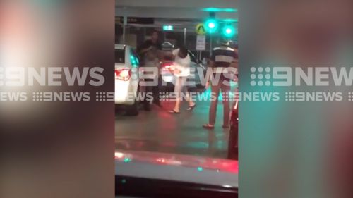 The taxi driver is seen being punched repeatedly as he tries to get away. (9NEWS)