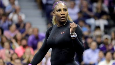 Serena Williams pumps her fist after a winner against Wang Qiang.