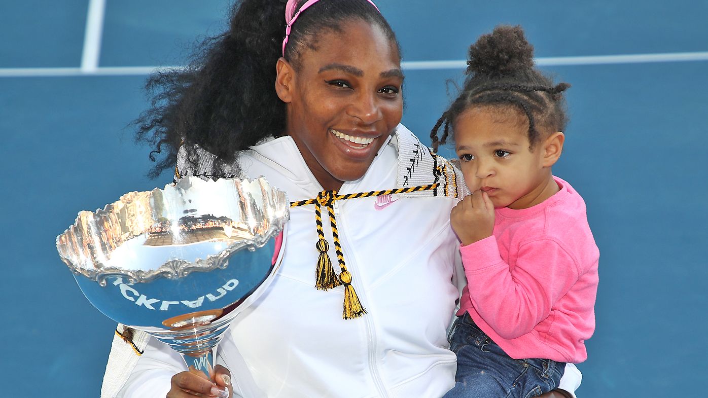 Serena Williams holds her daughter Olympia