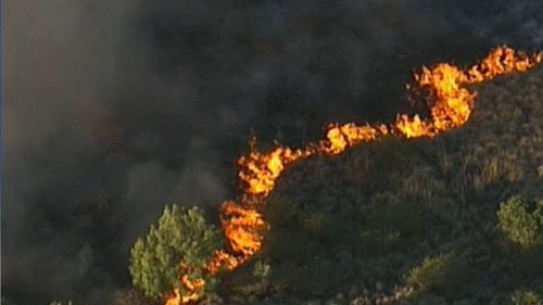 The fire near Gympie was not a threat to homes but being monitored by firefighters overnight.