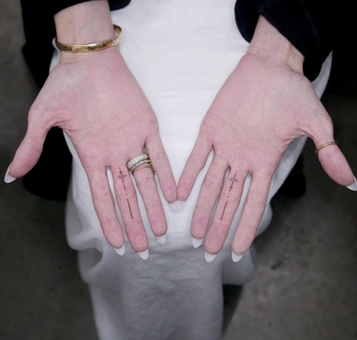Angelina Jolie's middle finger tattoos revealed
