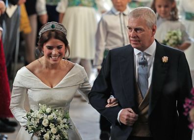 WINDSOR, ENGLAND - OCTOBER 12: Princess Eugenie walks down the aisle with her father, Prince Andrew, the Duke of York, for her wedding to Jack Brooksbank at St George's Chapel in Windsor Castle on October 12, 2018 in Windsor, England. (Photo by Yui Mok - WPA Pool/Getty Images)