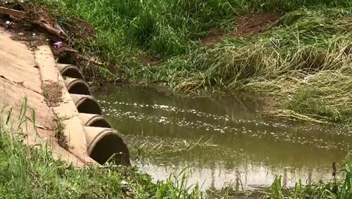 Townsville floods bodies found stormwater drain