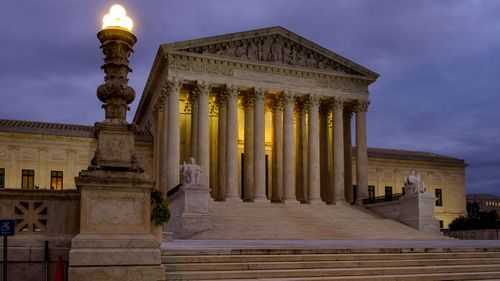 The US Supreme Court building stands quietly before dawn in Washington on Friday, October 5.