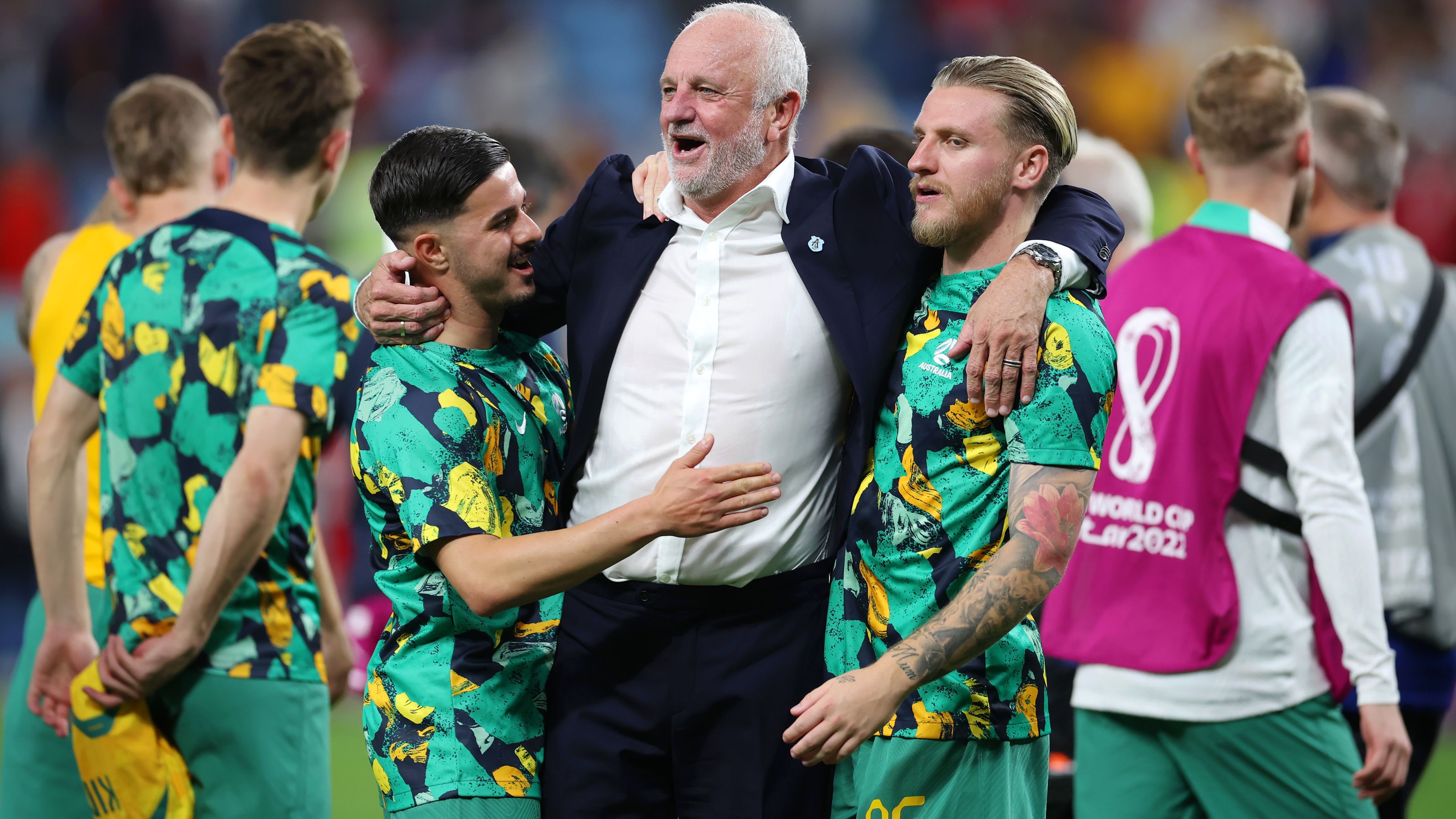 Graham Arnold is congratulated by his players after their 1-0 victory.