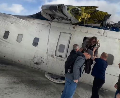 Passengers who survived a dramatic plane crash in Canada have recalled hanging upside down in the aircraft after it flipped on the runway.