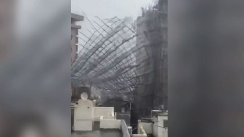 Part of a building breaks off in downtown Hong Kong.