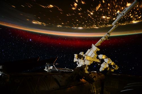 "The red curtain of an aurora closes on another day." (Twitter: Scott Kelly/NASA)