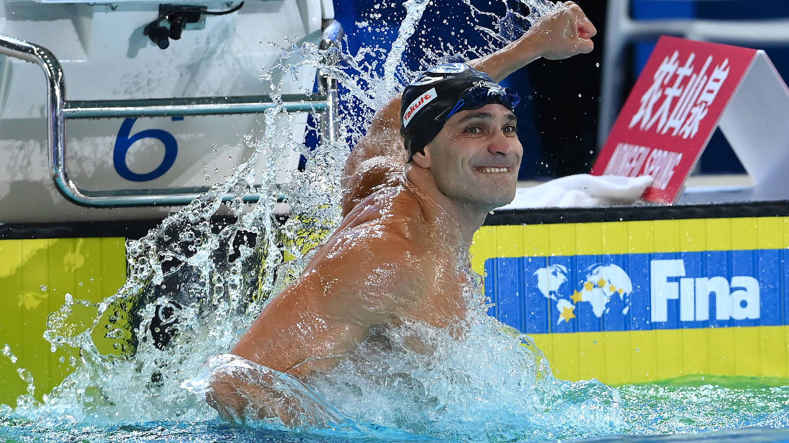 Forty-two-year-old Nicholas Santos claims gold, championship record in men's 50m butterfly final