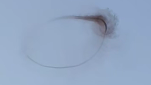 A black ring in the sky has slowly disappeared before shocked witnesses, raising questions about its origin. 