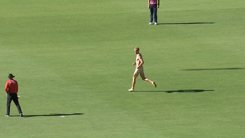 Ben Jenkins during his dash onto the field. 