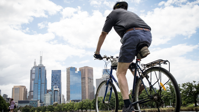 People enjoy riding bicycles along the Yarra River on November 19, 2020 in Melbourne, Australia. (Photo by Darrian Traynor/Getty Images)