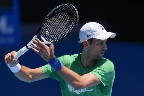 Defending mens champion Serbia's Novak Djokovic practices on Margaret Court Arena ahead of the Australian Open tennis championship in Melbourne, Australia, Thursday, Jan. 13, 2022. 