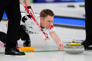 Canada's Marc Kennedy in action during the men's curling round-robin match against Switzerland at the Cortina Olympic Stadium.