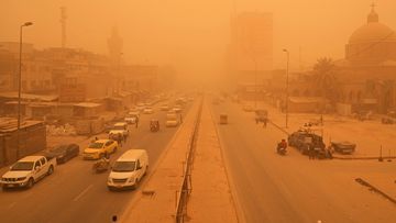 Cars drive through a sand storm in Baghdad, Iraq, Monday, May 16, 2022. (AP Photo/Hadi Mizban)