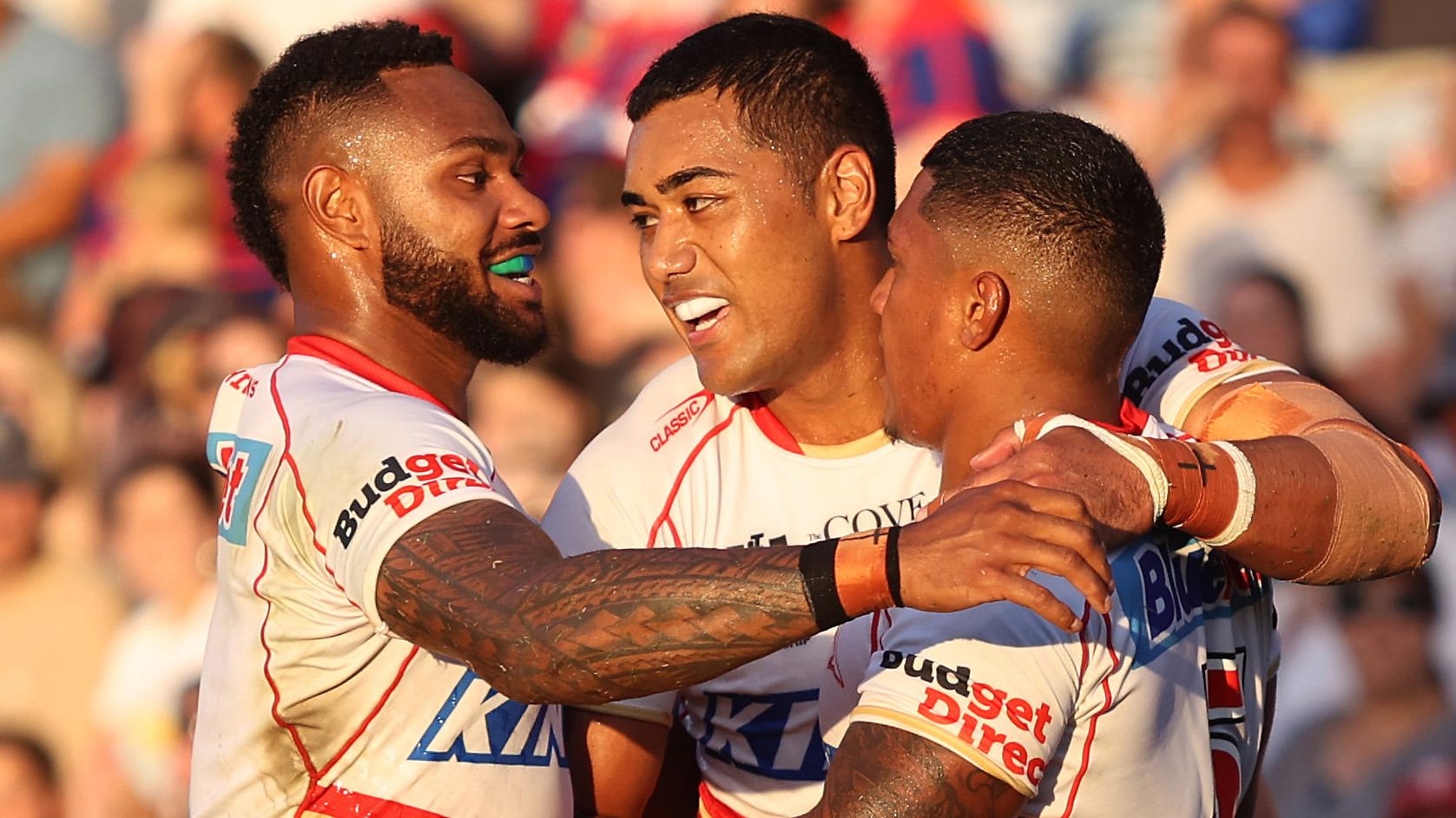 Tesi Niu of the Dolphins celebrates a try with teammates during the round three NRL match between Newcastle Knights and Dolphins at McDonald Jones Stadium on March 17, 2023 in Newcastle, Australia. (Photo by Scott Gardiner/Getty Images)