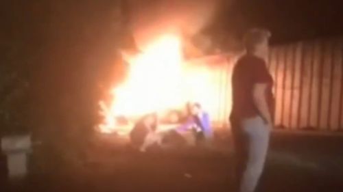 Onlookers captured the fiery wreckage on their phone cameras. (9NEWS)